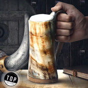Experience the ultimate in Viking-inspired beer drinking with our premium drinking horn. Made with a durable oak wood bottom and traditional horn design, this tankard is perfect for any beer enthusiast looking to add a touch of Viking culture to their collection. Impress your friends at your next drinking party with this unique and sturdy Viking beer mug.